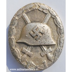 WOUND BADGE IN SILVER "L55"...